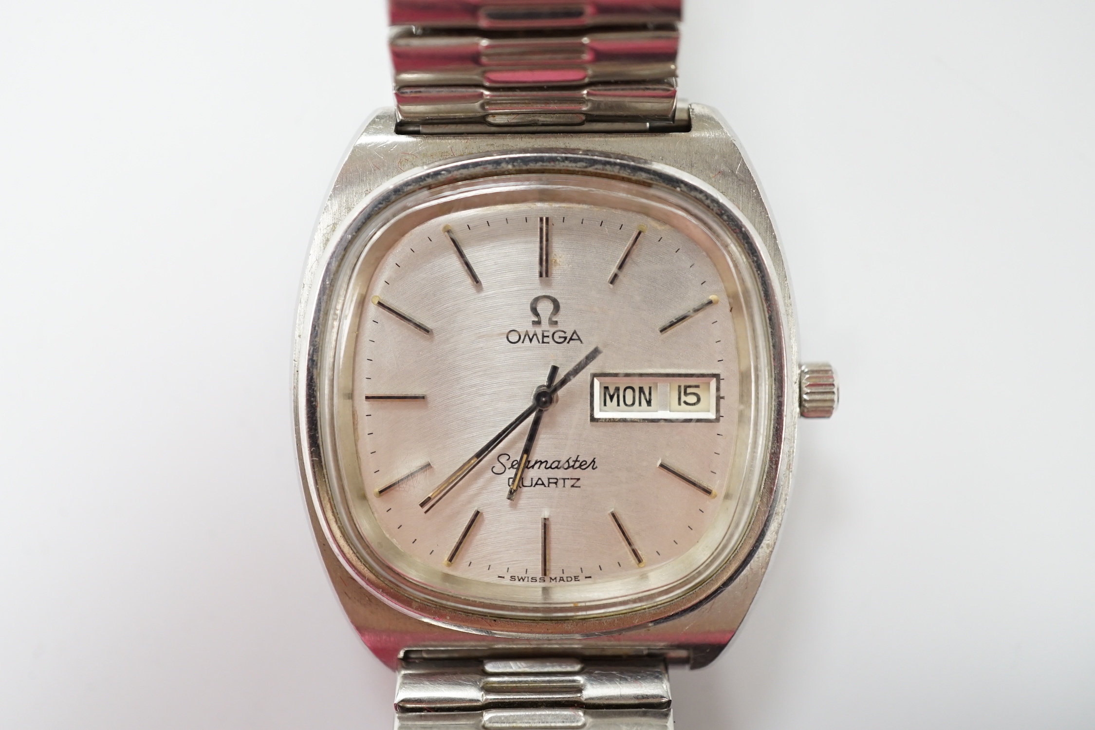 A gentleman's 1980's stainless steel Omega Seamaster quartz wrist watch, with day date aperture, on associated flexible strap, with box and papers.